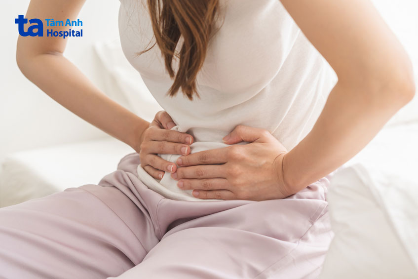 đau bụng là dấu hiệu phôi làm tổ